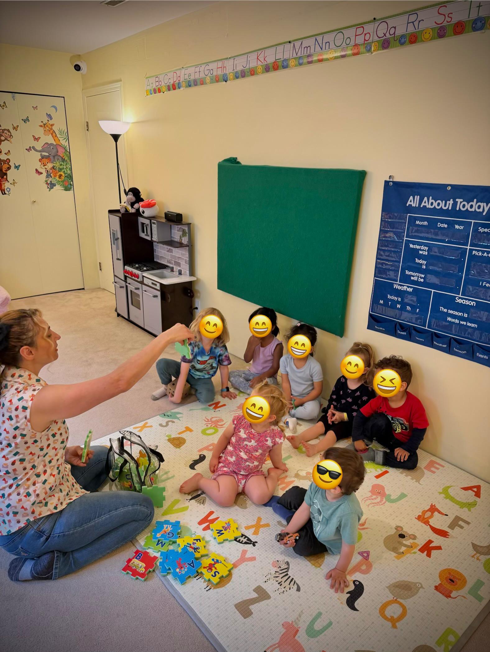 Children listening during circle time with Bahar
