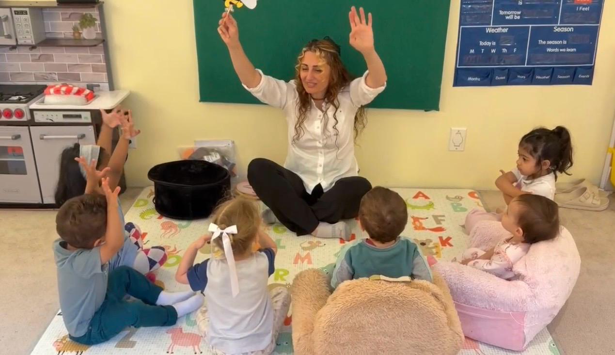 Children participating in circle time with their educator