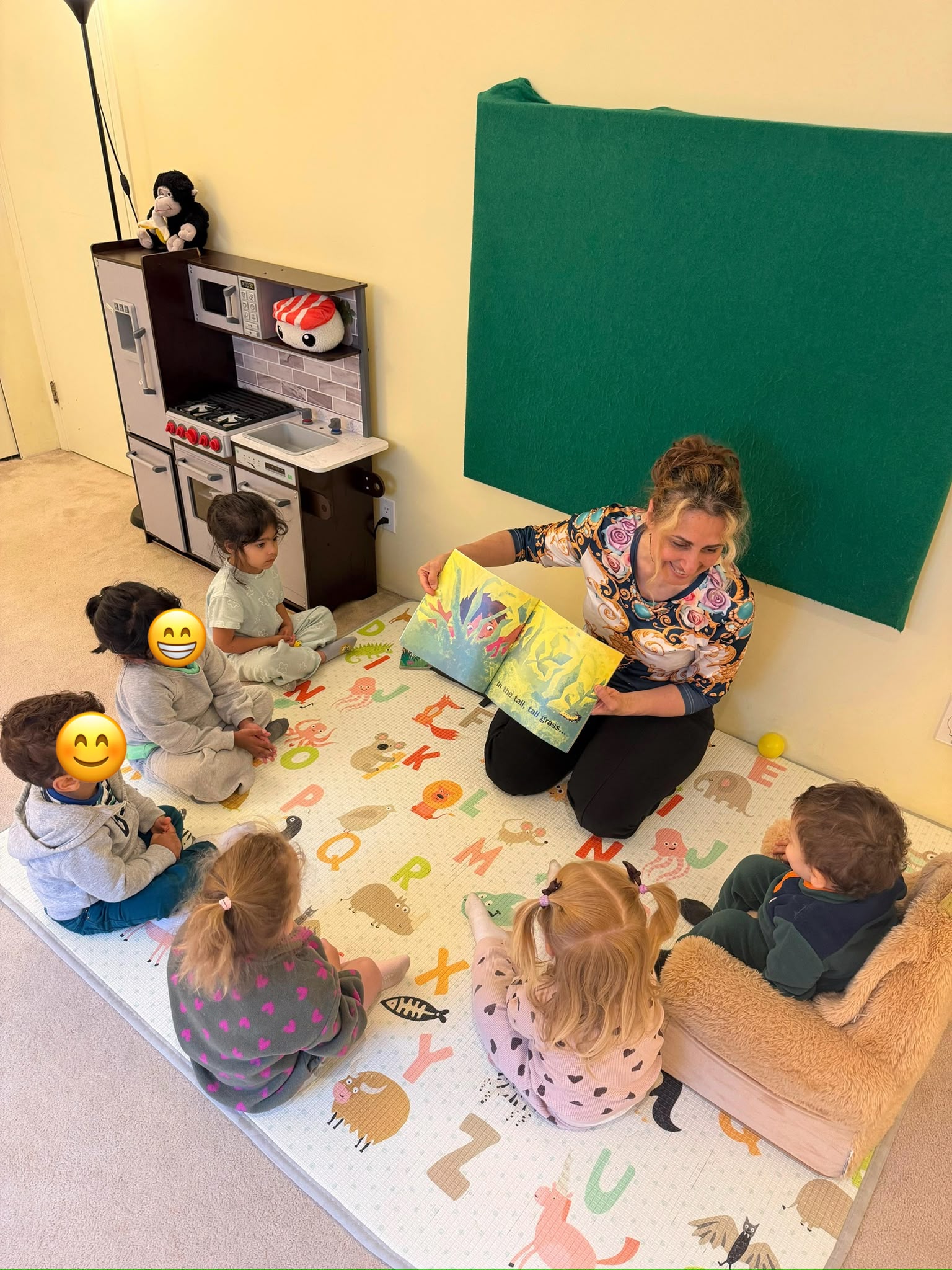 Children sitting together on the rug for story time