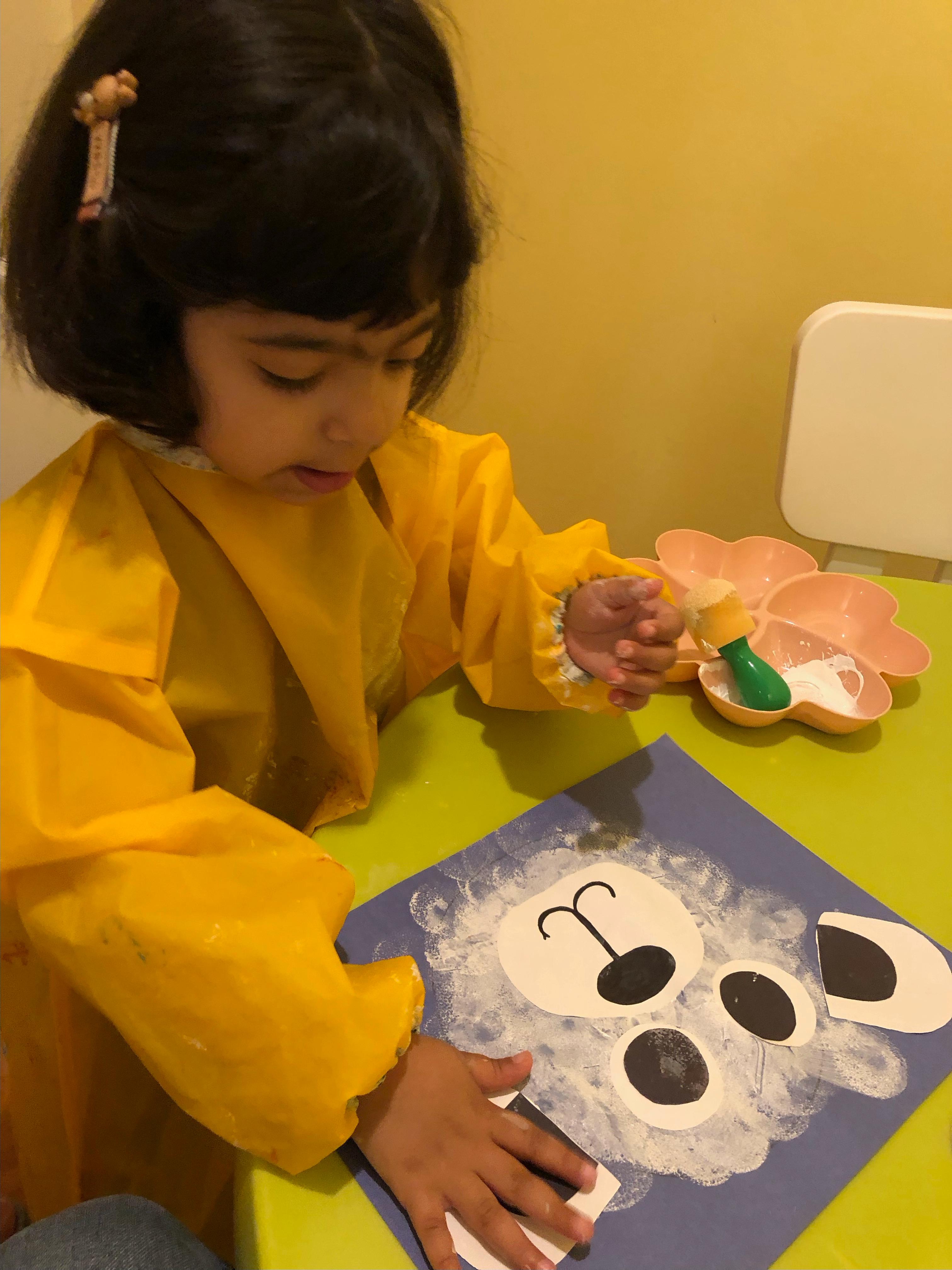 Child painting during an art activity