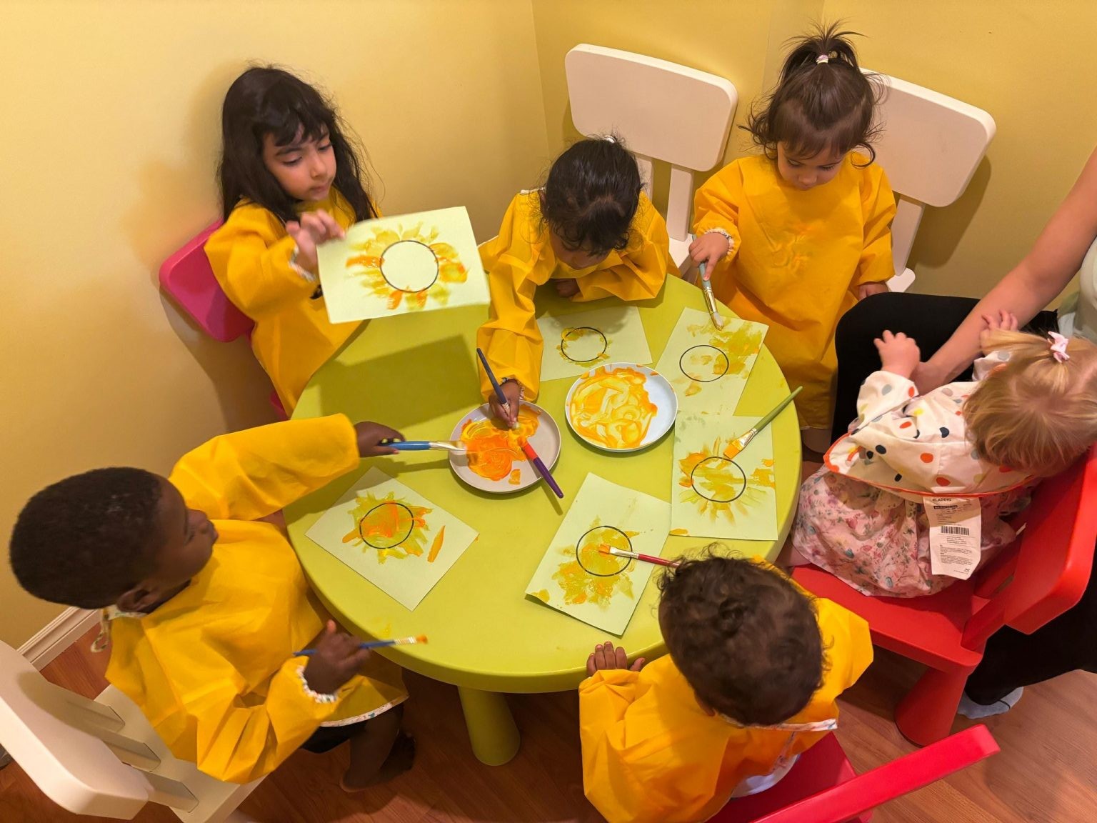 Children painting together during an arts and crafts activity