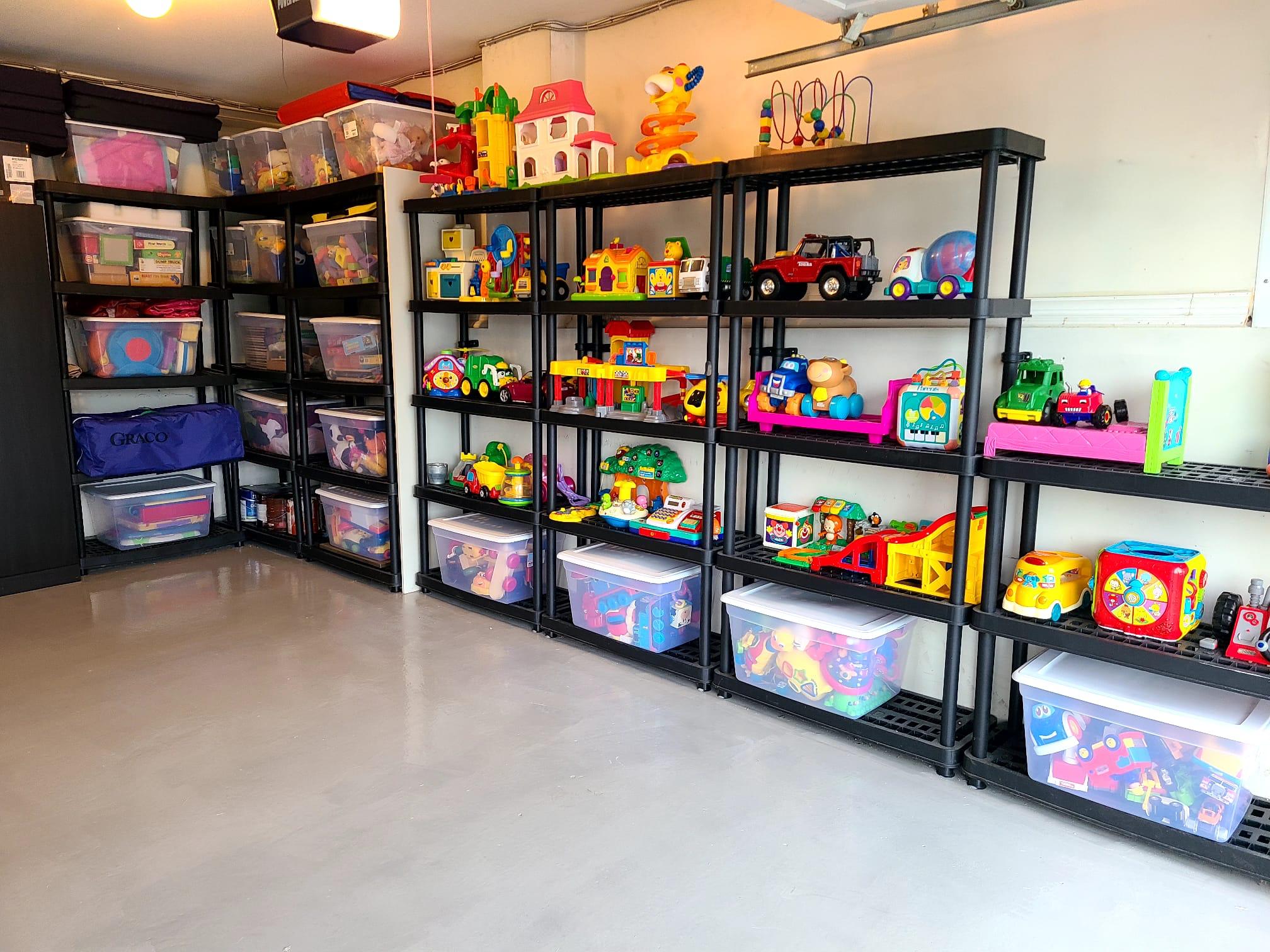 Organized toy shelves with bins and colorful play materials